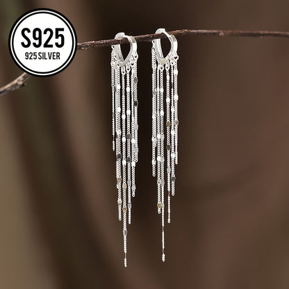 This lightweight and elegant heart tassel ear thread is made of hypoallergenic 925 silver, giving it a shiny and luxurious appearance. The long tassel design helps to slim the face and adds a touch of simplicity and fashion to any outfit. It is a perfect