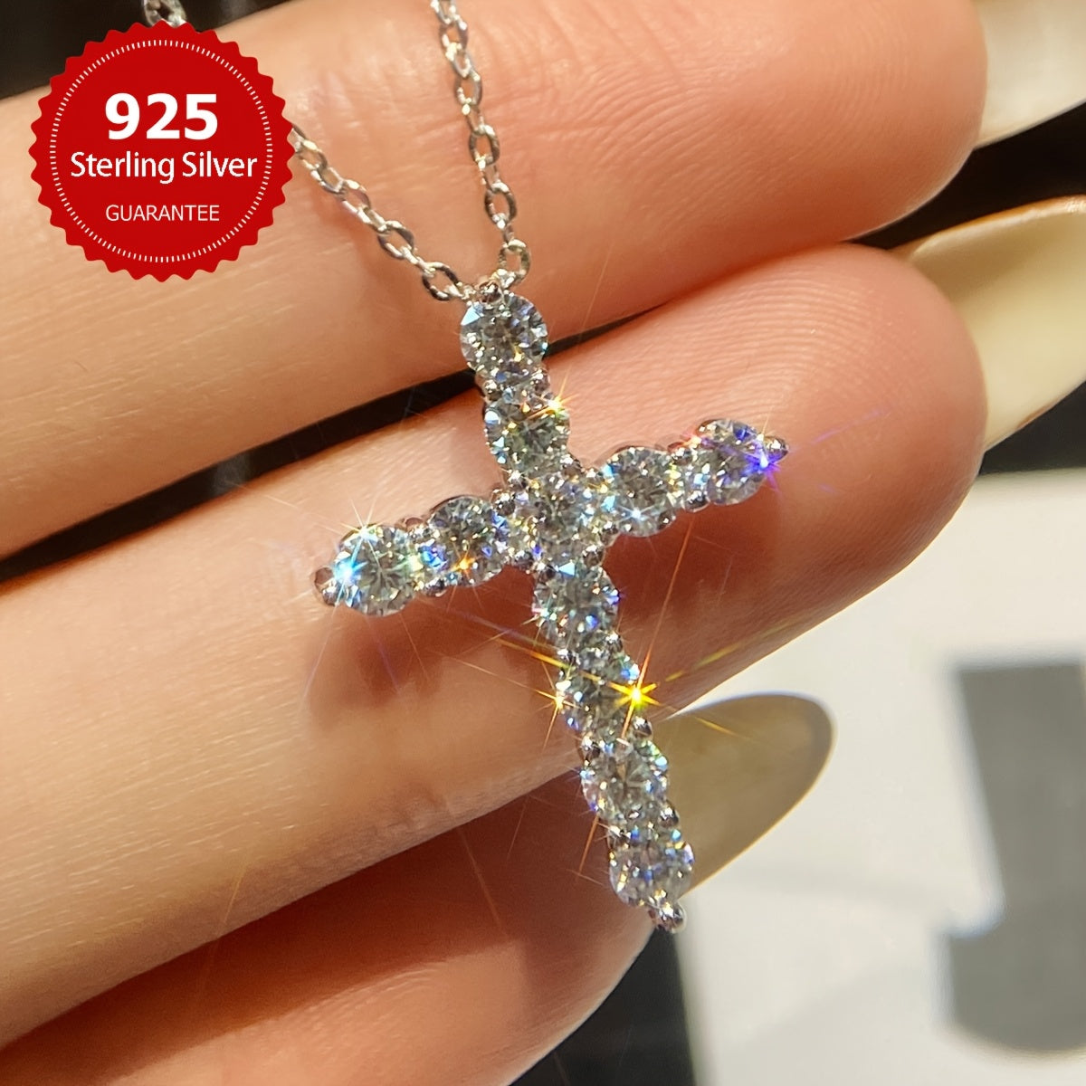 The stunning Mozambique stone cross pendant necklace features a 1.1 carat stone set in S925 sterling silver, making it a luxurious Valentine's Day gift for the special lady in your life. This exquisite piece of ladies' jewelry includes 11 0.1 carat