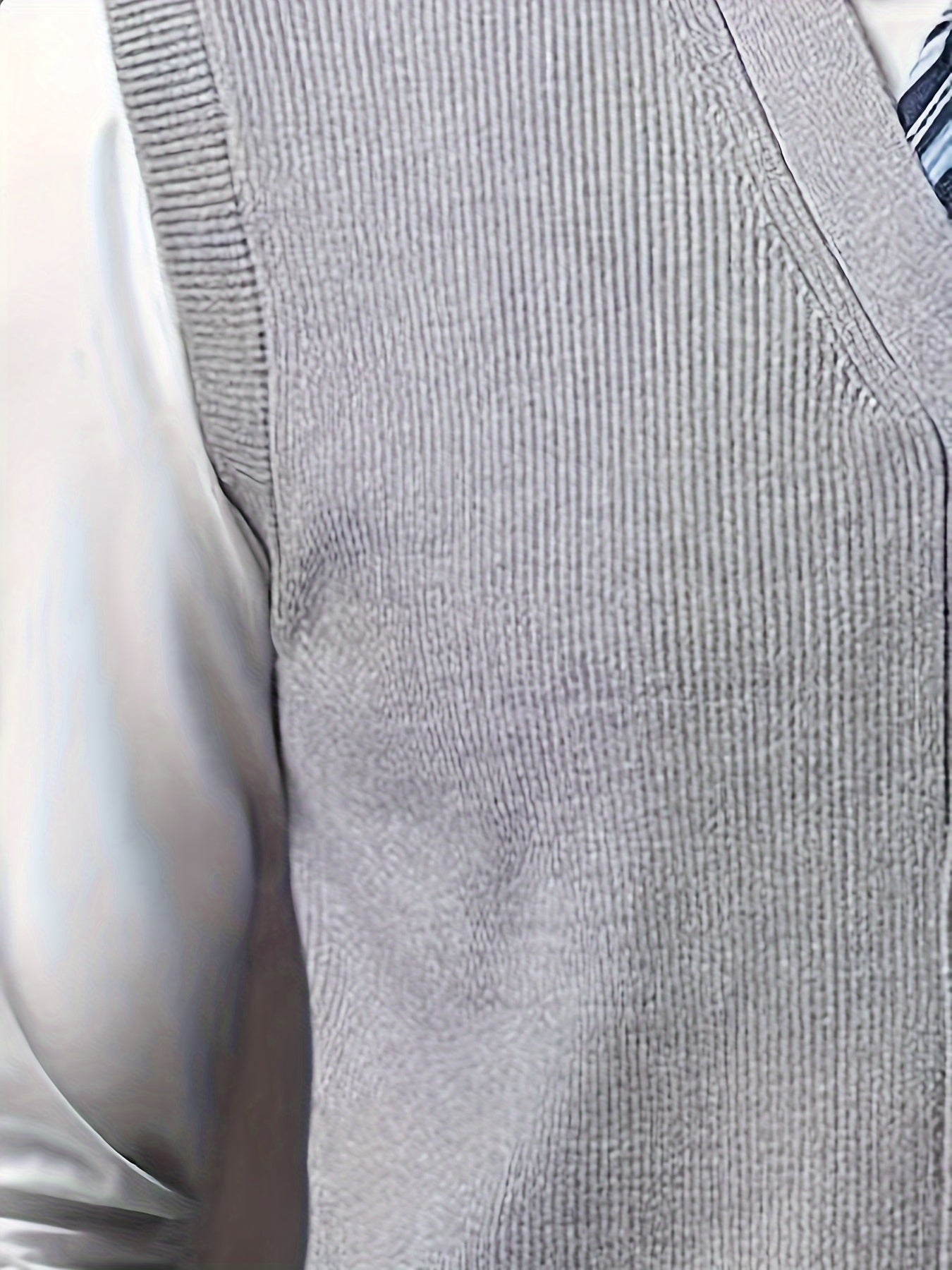 Men's solid color V-neck knitted vest for autumn and winter.