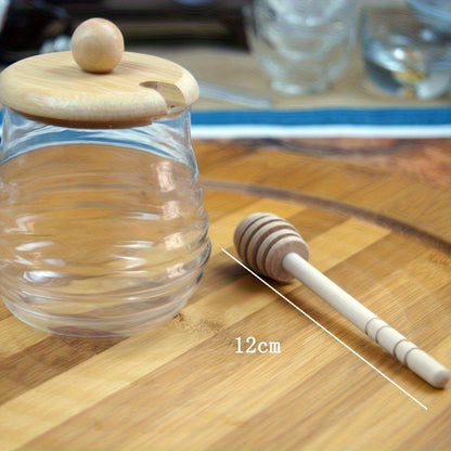 Glass honey jar with bamboo lid and dipper - ideal for kitchen storage and baking essentials