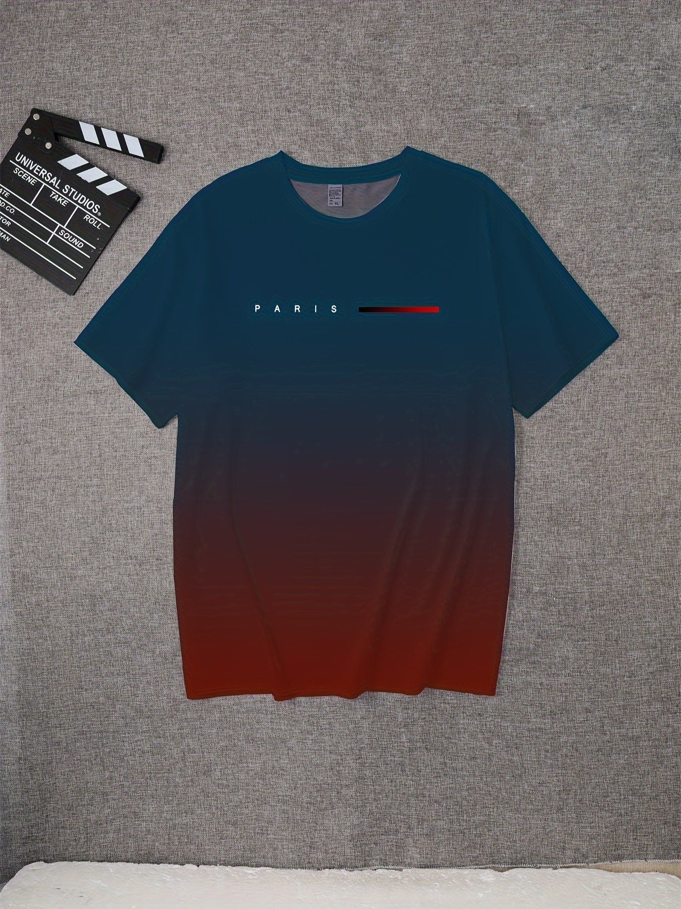 Vintage-inspired gradient Paris graphic tee for men features a black to red transition with iconic "PARIS" design. Made of a polyester blend, it has a crew neck, short sleeves, and is