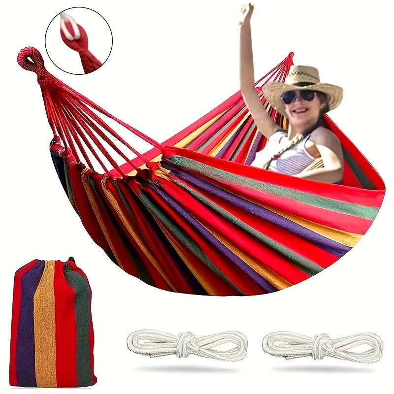 Colorful fabric hammock with anti-roll design, supports 149.69KG, tree-friendly straps, portable carrying bag. Ideal for outdoor, indoor, and camping use.