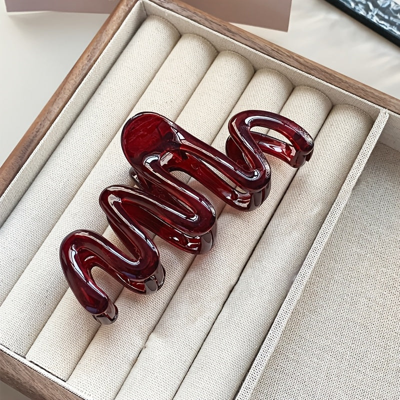 3 Wavy Leopard Print Hair Claw Clips in Clear, Red, and Brown. Stylish plastic accessories for everyday and gifting.