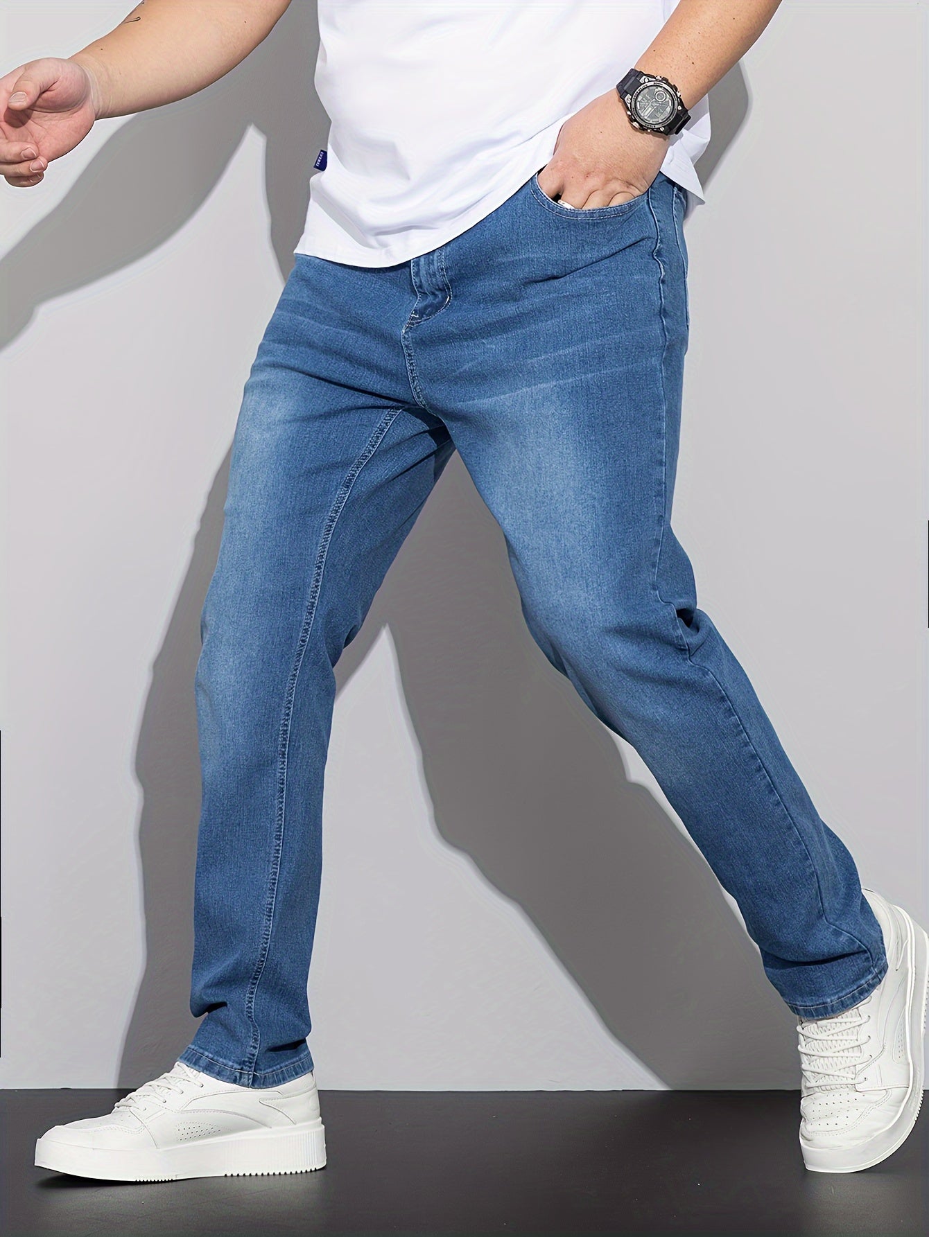 Stylish men's plus size denim pants for casual street style in spring and fall.