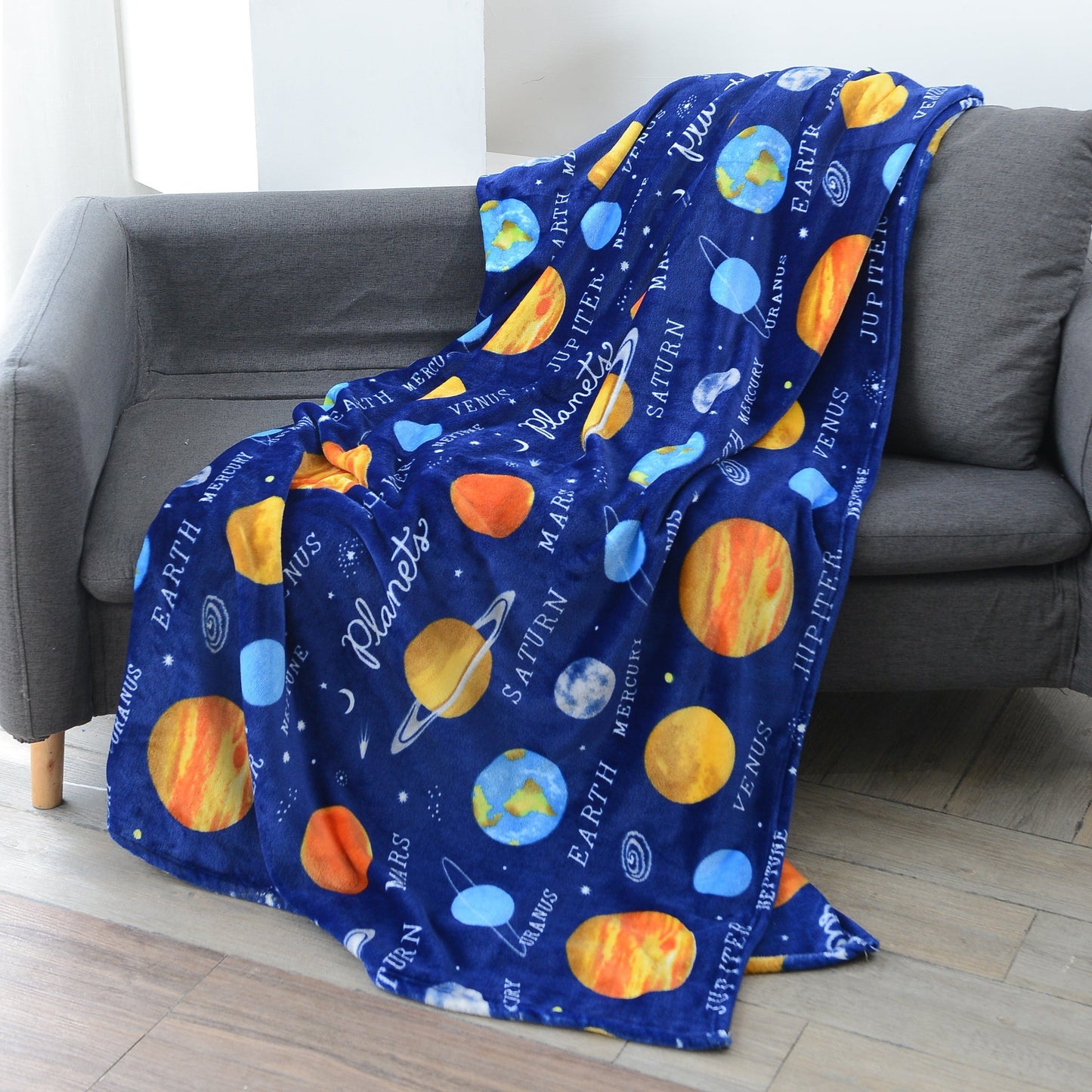 Warm and soft Cozy Astronaut Flannel Throw Blanket with Space Theme - Reversible for couch, bed, office, and travel. Perfect for galaxy lovers, nap time, and adding a touch of mission and wavering style to any space.