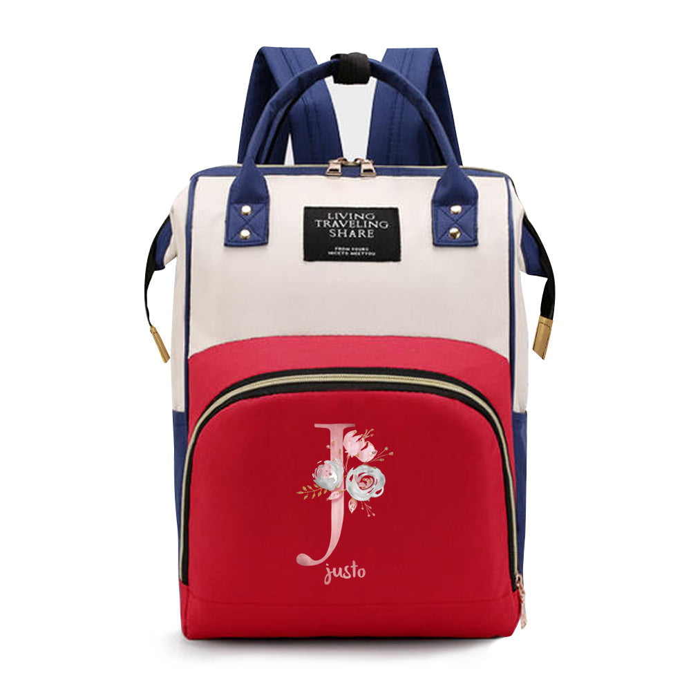 Personalized Mommy Backpack made of durable Oxford cloth with ample storage space for diapers and other essentials. Features customizable initials and name, as well as convenient bottle pockets. Perfect for nursing mothers on-the-go, with options for A-Z