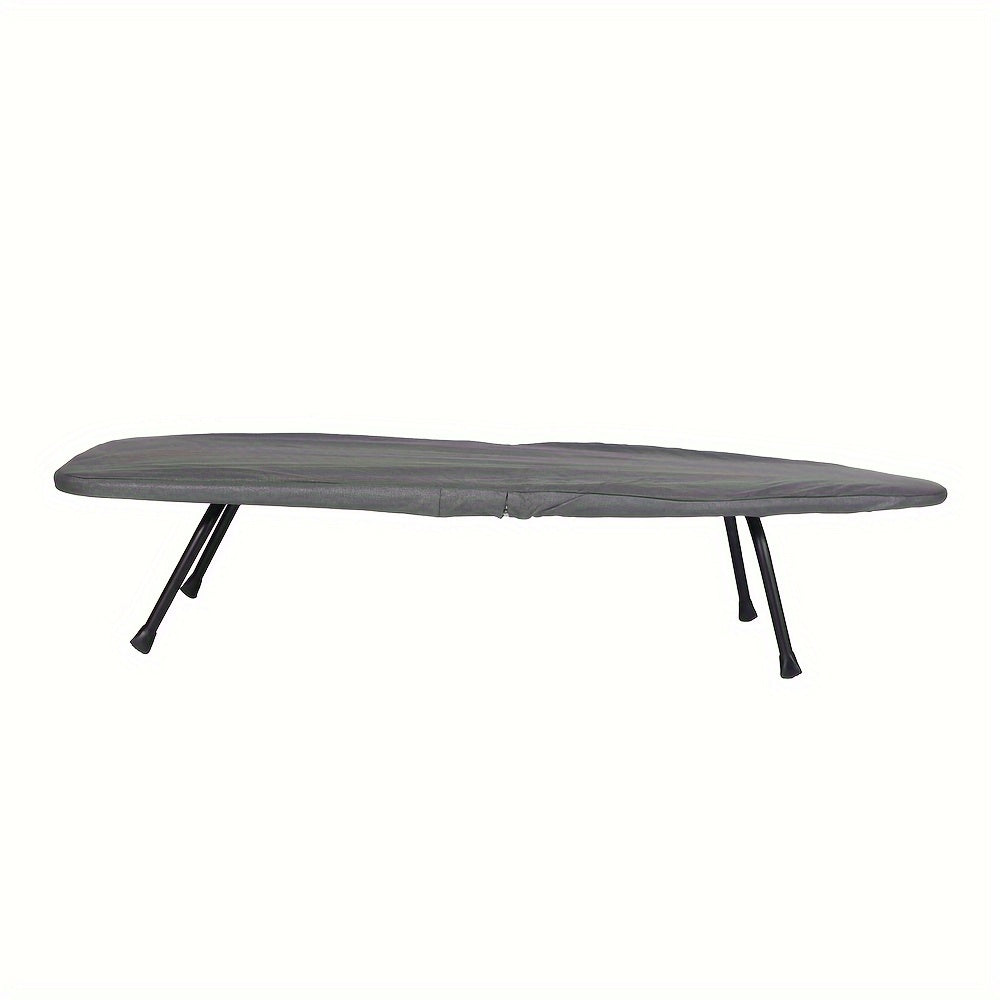 An ironing board for desktop use that is made of iron, compact, and foldable for convenient storage and transport. Features a surface made of needle cotton fabric that can withstand high temperatures, making it ideal for both home and travel use.