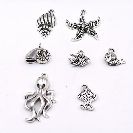 An assortment of 50 assorted golden conch, shell, turtle, fish, and seahorse pendants - Vintage-inspired silver marine life charms perfect for crafting unique DIY bracelets, earrings, and necklaces.