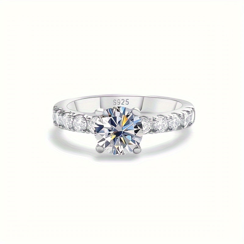 The GEMS LADY Elegant Luxury Engagement Ring features a 1 Carat Moissanite stone set in S925 Sterling Silver. With its Round Gemstone design, it is perfect for Weddings and Gifts, and has a Christmas Holiday Theme. Each ring comes with a Certificate of