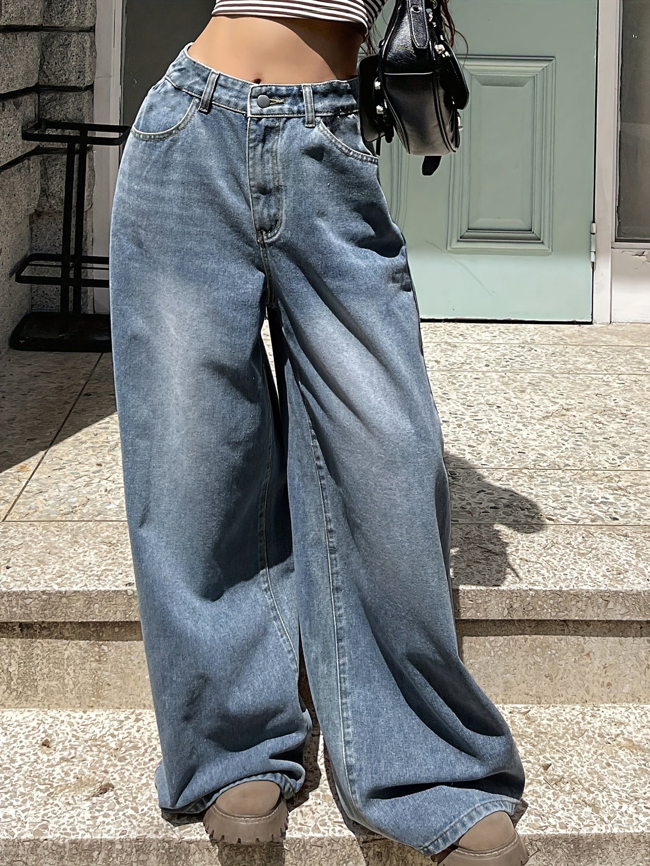 Water washed blue extra long wide leg jeans for women, perfect for casual autumn wear.