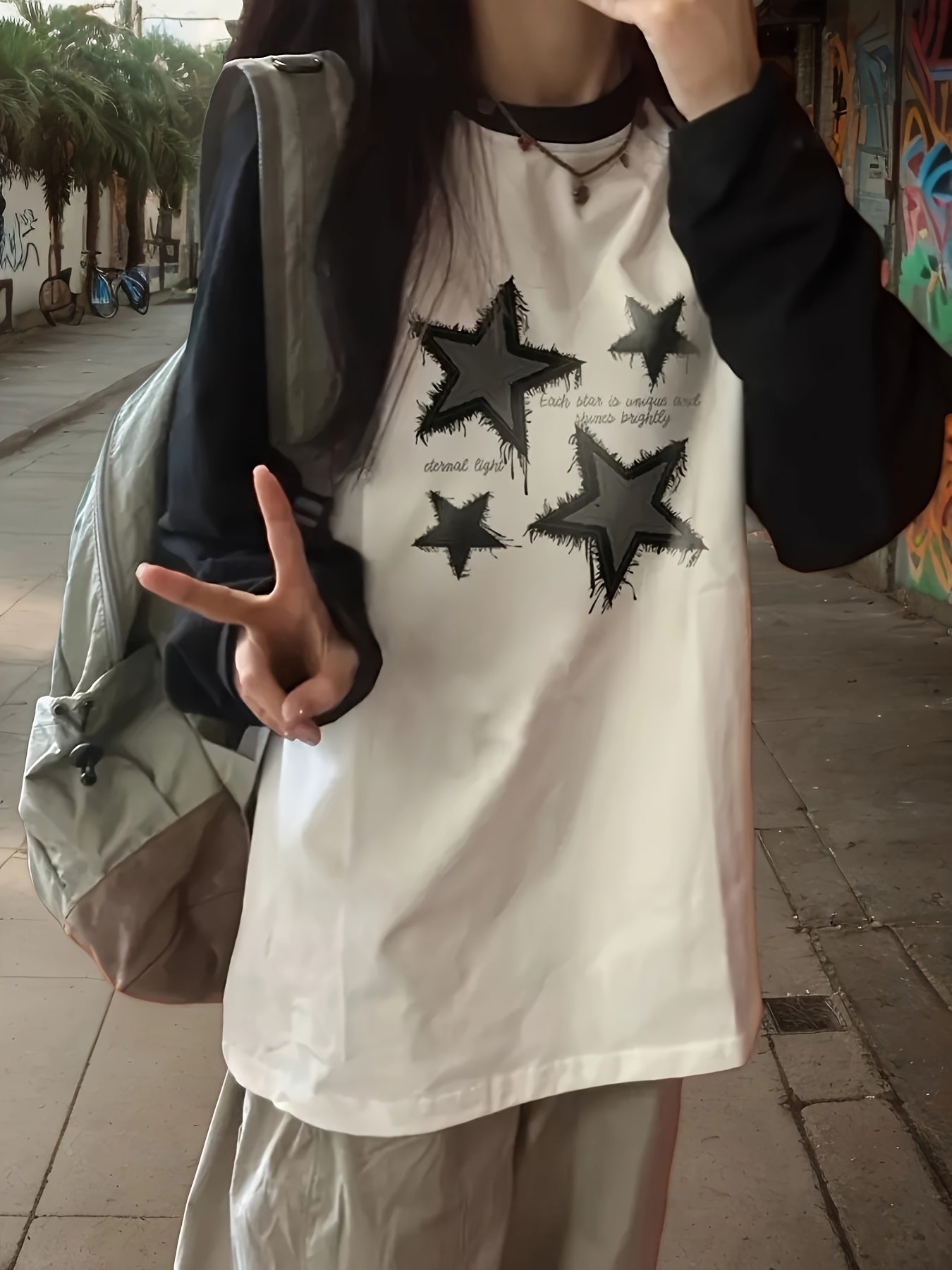 Women's Casual Raglan Long Sleeve T-Shirt in Black and White Geometric Star Print, Round Neck, Loose Fit Pullover Top for Spring/Autumn made from Knit Polyester-Blend.