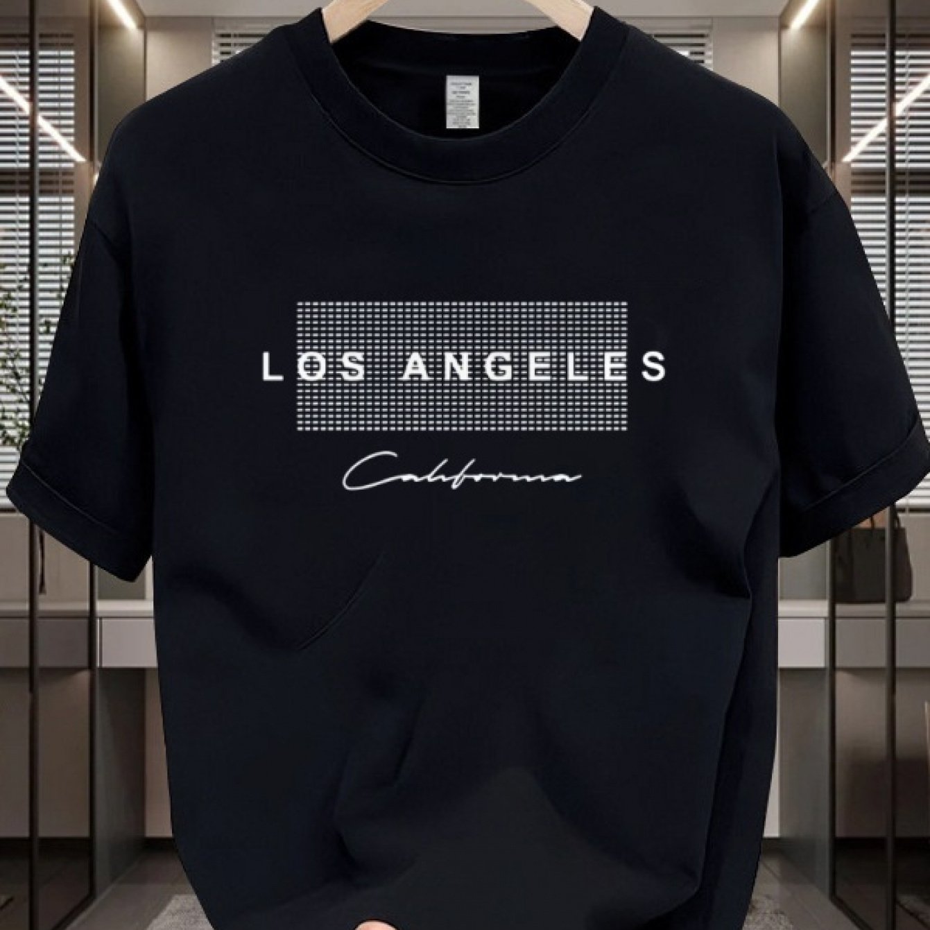 Men's casual cotton T-shirt with crew neck and short sleeves. Made from 100% cotton knit fabric, providing all-season comfort. Features a solid color and a Los Angeles California graphic