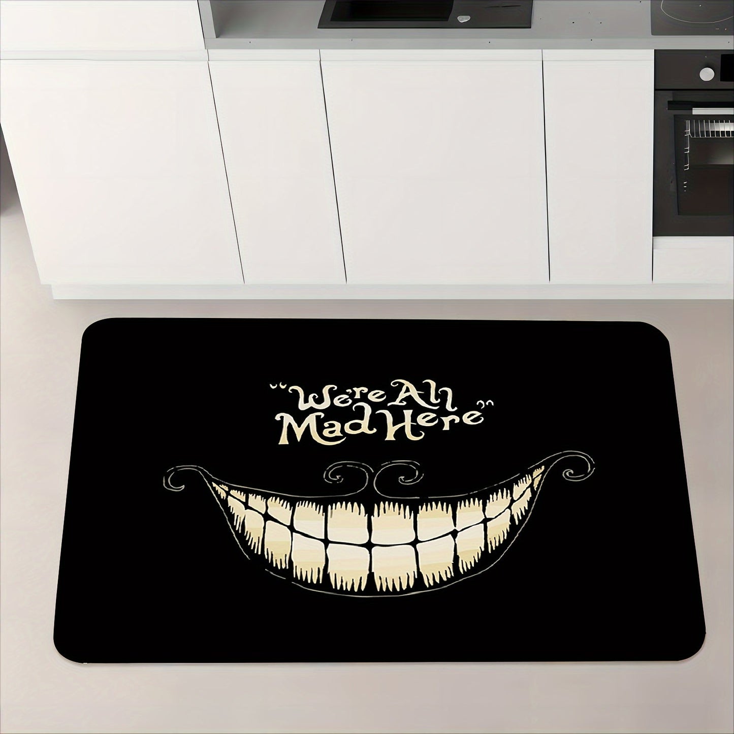 Welcome to Cheshire Smile Doormat - A soft and absorbent entrance mat made from polyester fleece, featuring a charming tooth and letter print design. This 1cm thick mat is anti-slip and perfect for your living room, bedroom, front door, or hallway. Add a