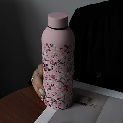 Stylish 16.9oz insulated water bottle with chic pink floral design, perfect for travel, sports, and everyday use. Great gift for birthdays and holidays.