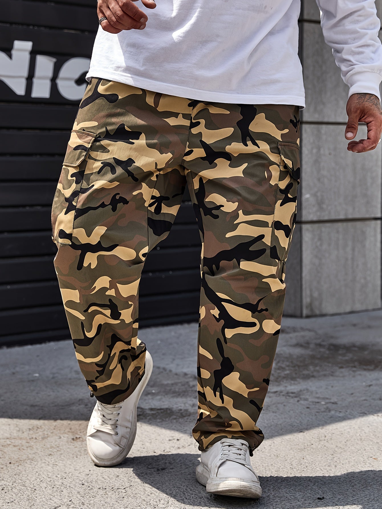 Men's plus size camo cargo pants, made of durable polyester with drawstring waist and multi-pocket design for outdoor activities.