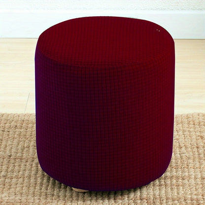 Stretchable round footstool cover made from soft polyester blend with elastic fit. Available in multiple colors, machine washable, modern design for living room ottomans.