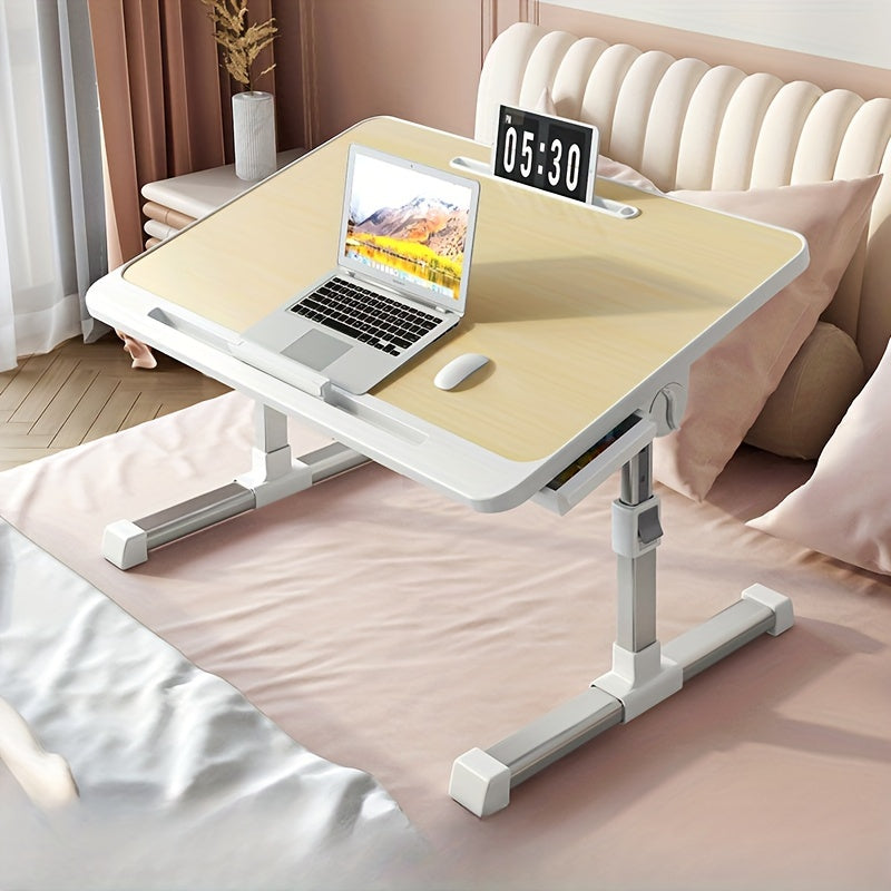 Adjustable folding bed tray with drawers, ideal for laptop use or eating in bed. Can also be used as a portable table for reading or writing. Available in silvery grey.