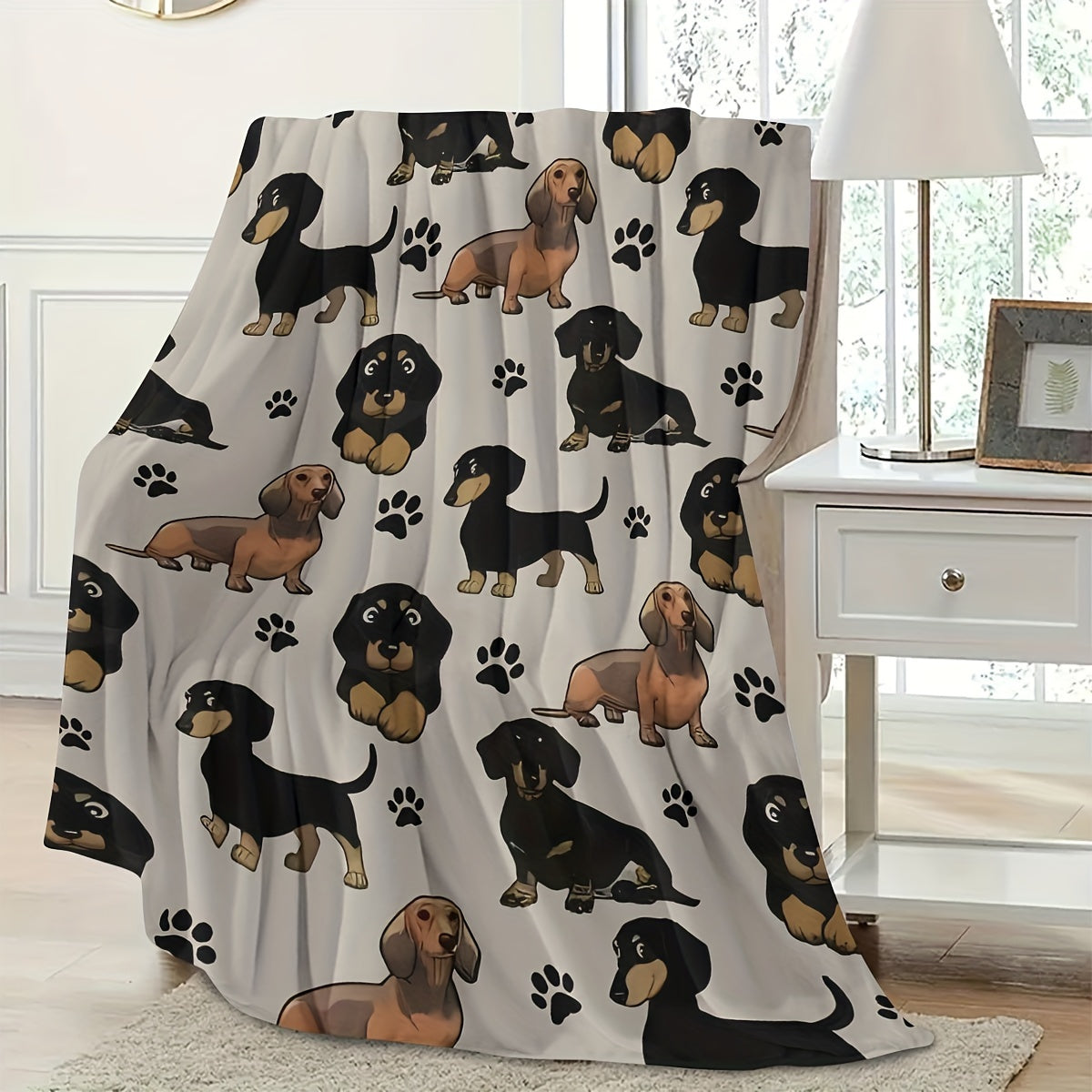 Soft and cozy Dachshund dog print fleece blanket perfect for pet lovers. This all-season throw is machine washable with a digital print design on a polyester cover and lining. Made with 200-250gsm knitted fabric in a contemporary style, this