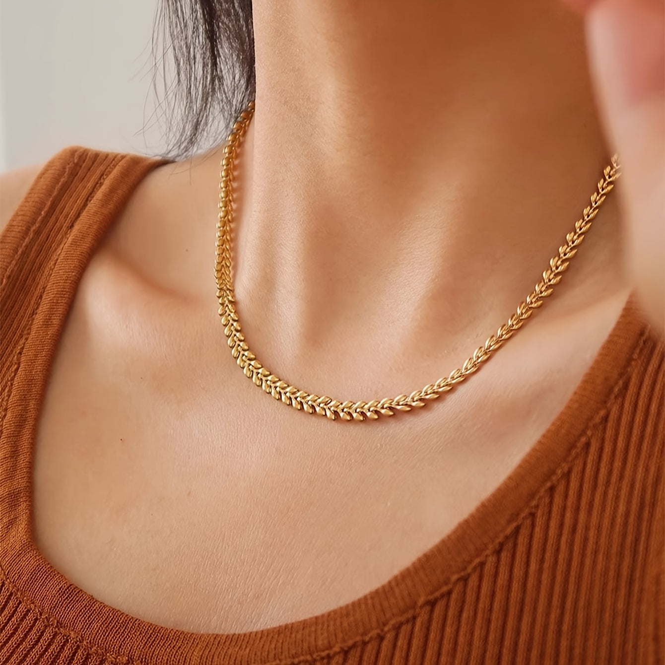 Vintage punk style stainless steel necklace with a simple golden wheat design, perfect for women to wear as a collarbone chain.