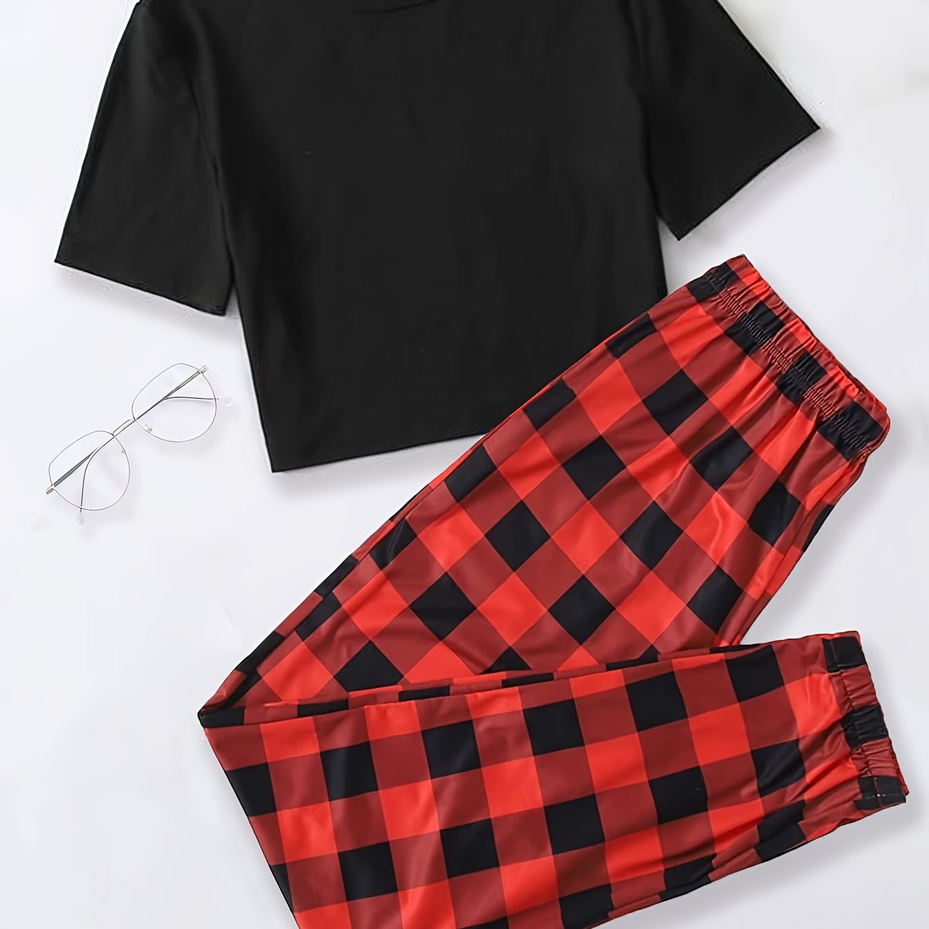 Plaid pajama set for women featuring a short sleeve top and elastic waistband pants.