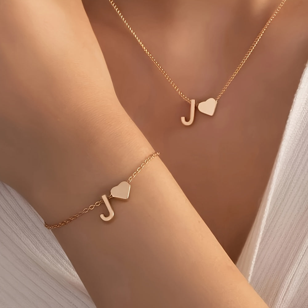 Chic two-piece set with metal heart and letter necklace and bracelet, ideal for daily wear.