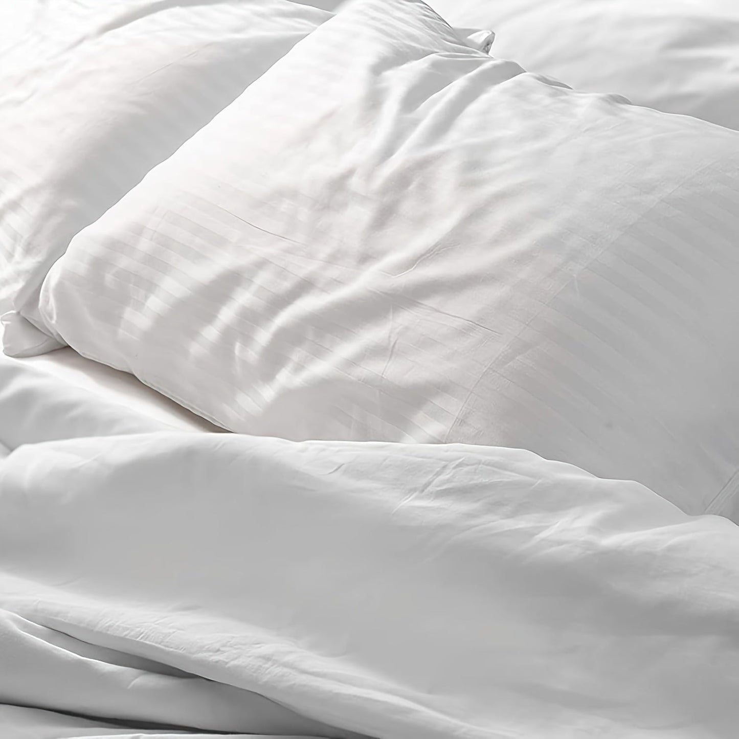 This set includes two pillowcases featuring a zipper for easy use. Made from luxury hotel-quality material, these pillowcases are soft, breathable, and non-balling. The striped woven design adds a touch of elegance to your bedding.