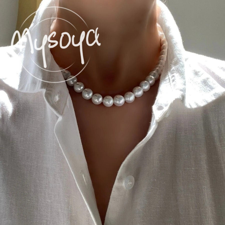 Elevate your style with the MYSOYA Elegant Large Natural White Pearl Necklace, featuring stunning 9-10mm pearls. This necklace comes in an exquisite gift box, making it perfect for any occasion - from daily wear to parties, birthdays, anniversaries