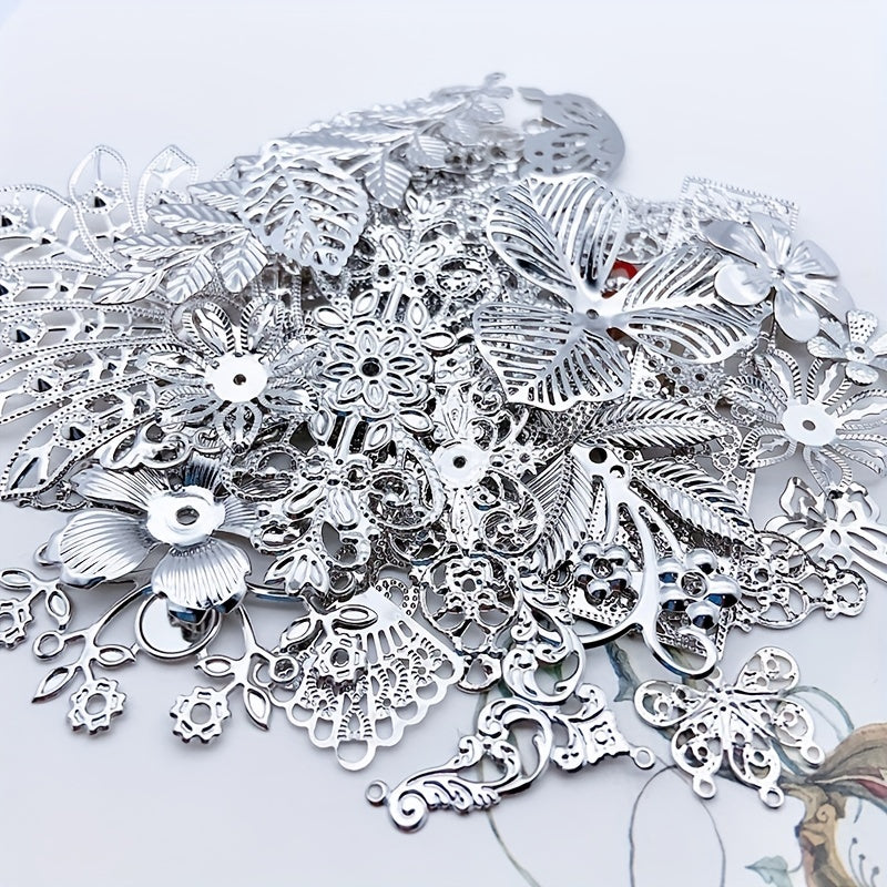 A set of 50g of white, golden, and silvery alloy charms featuring a mix of carved flower and leaf designs. Perfect for crafting pendant necklaces and other DIY jewelry projects. Get your hands on these unique and stylish supplies for making accessories.