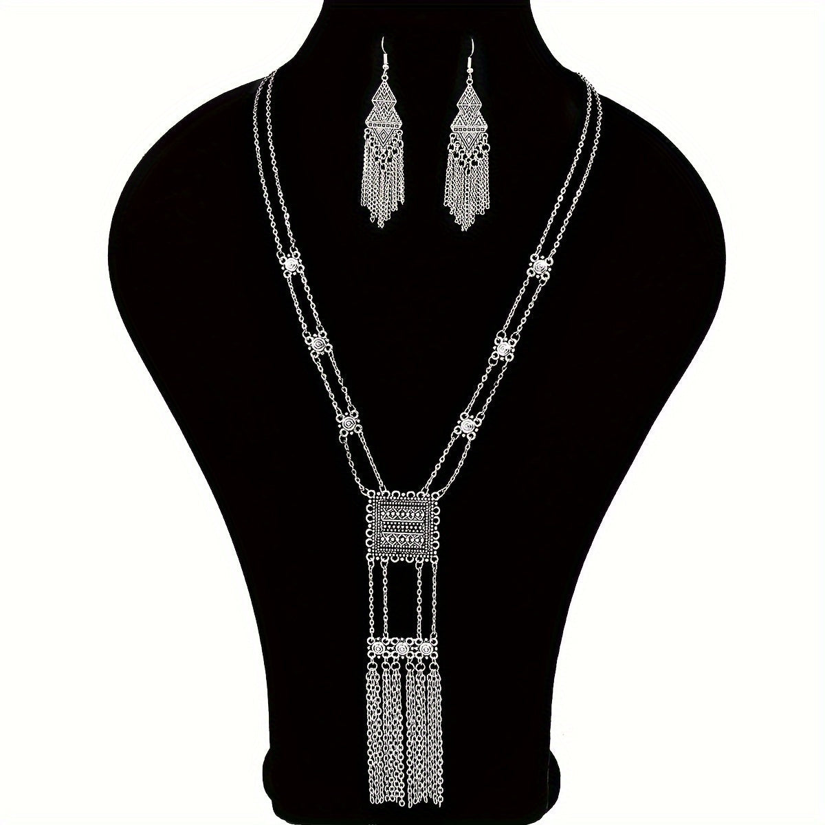 This retro ethnic style women's jewelry set includes three pieces: a geometric zinc alloy necklace and matching tassel long earrings. The set is simple, stylish, and versatile, suitable for all seasons and can be paired with a long skirt or sweater.