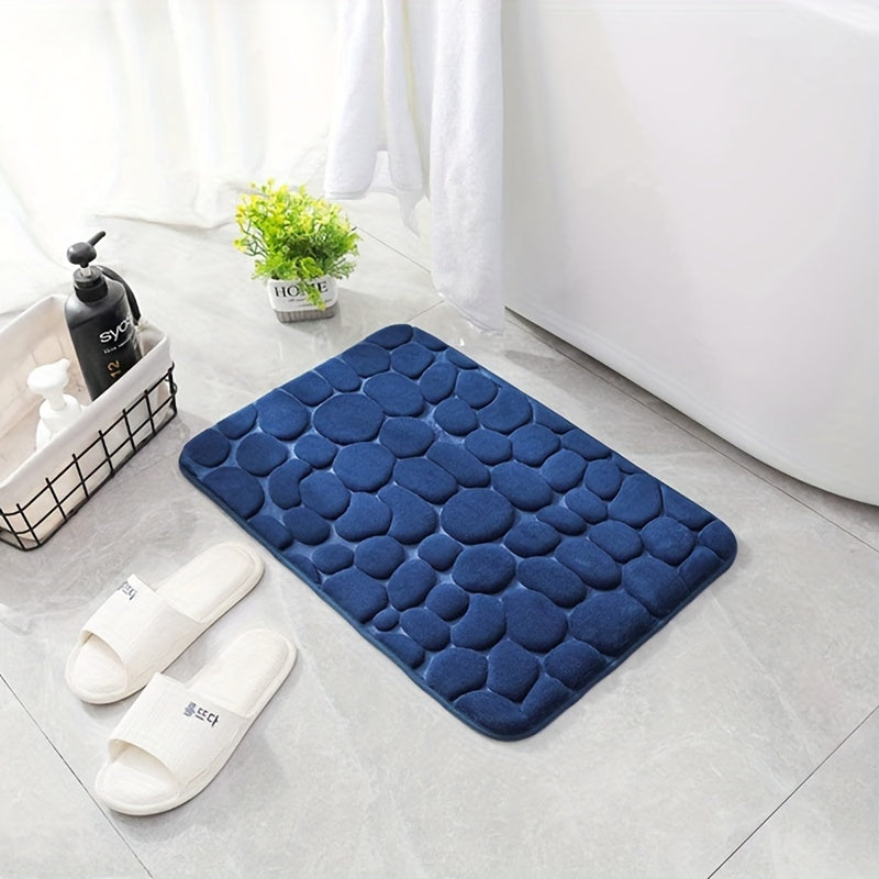 Soft, non-slip bath rug with excellent absorbency; machine washable with oblong shape and low pile.