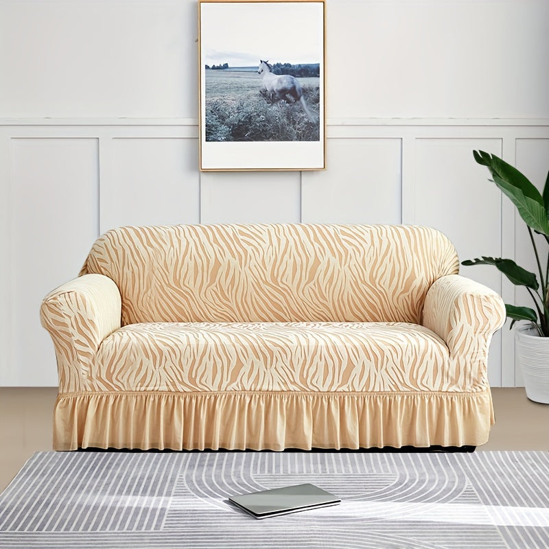 Wave pattern sofa slipcover with skirt, non-slip and dustproof. Protects furniture from cat scratches. Machine washable for easy cleaning. Suitable for bedroom, office, or living room décor.