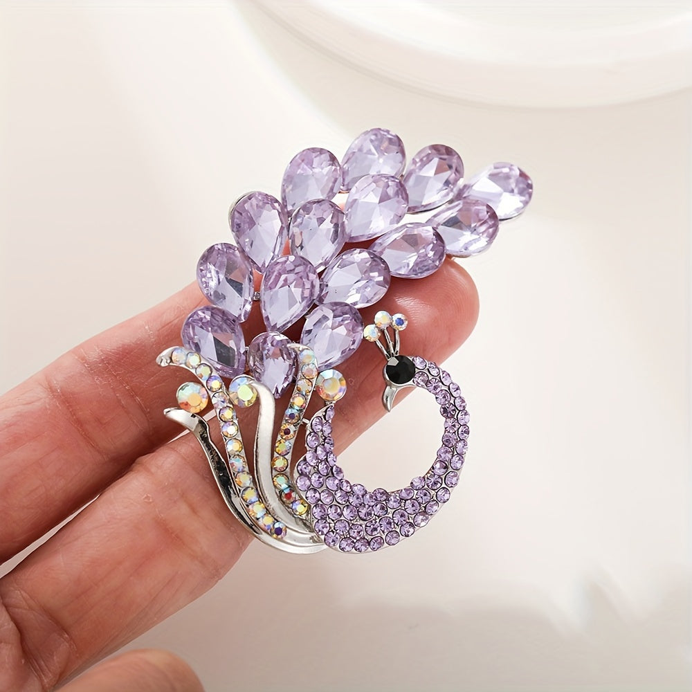 A beautiful purple crystal brooch pin, featuring an elegant and unique design with rhinestones. This fashion accessory is made from high-quality alloy material and showcases a stunning peacock design, perfect for women who appreciate stylish and