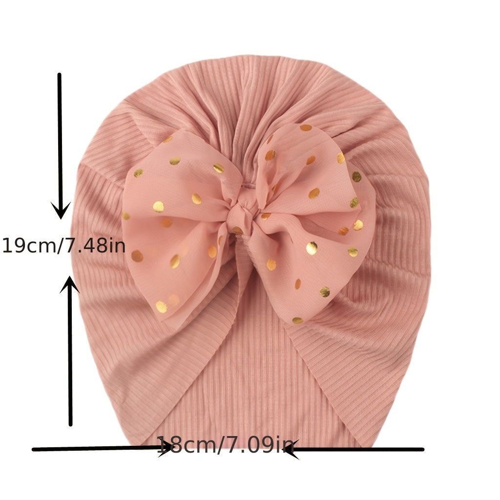 Polka dot printed bow head wrap for newborn infants and toddlers.