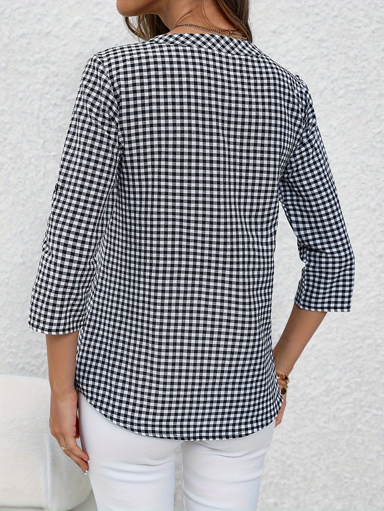 Women's yellow & white plaid button-up shirt with v-neck, long sleeves, and polyester fabric. Casual wear.