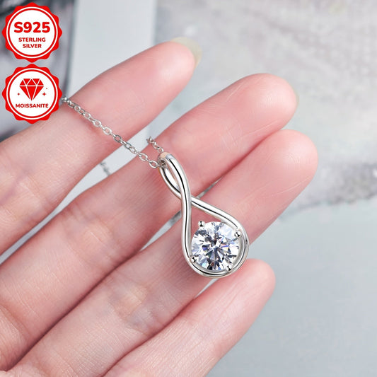 Elegant 14K Gold Plated 925 Sterling Silver Moissanite Pendant Necklace featuring a 8mm D Color Infinity Theme Synthetic Stone. This simple vacation style jewelry has a total weight of 2 carats and comes with a 20-inch chain. Perfect for weddings