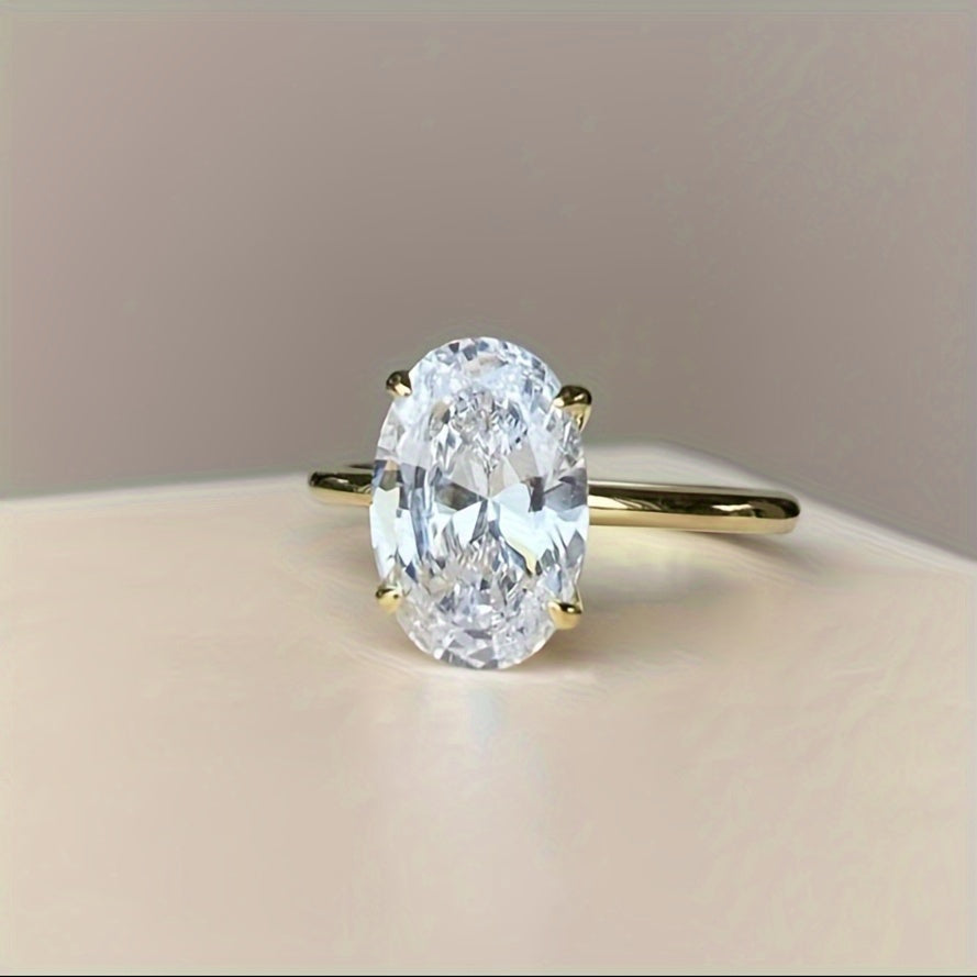 Simple and elegant 14K gold plated S925 silver ring featuring an oval cut synthetic cubic zirconia in 1CT, 2CT, or 3CT. Perfect for daily wear or as a thoughtful gift.