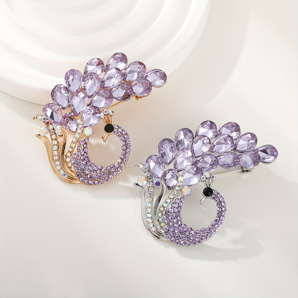 A beautiful purple crystal brooch pin, featuring an elegant and unique design with rhinestones. This fashion accessory is made from high-quality alloy material and showcases a stunning peacock design, perfect for women who appreciate stylish and