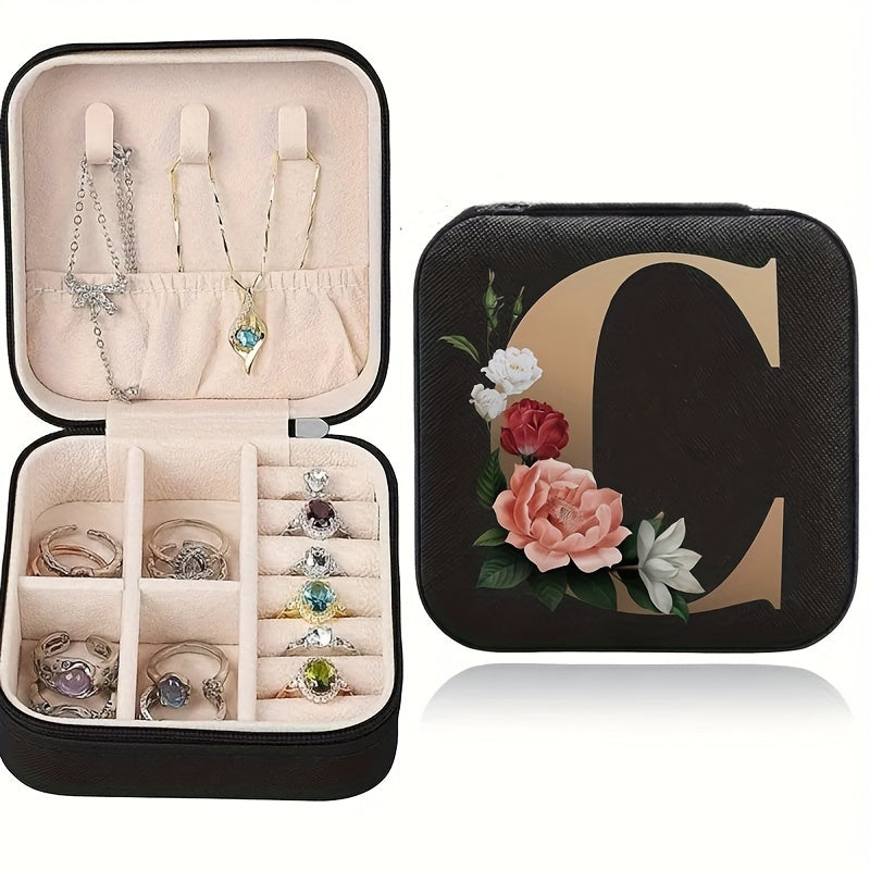 Floral initial jewelry organizer box with compact design, soft velvet lining, durable zipper, and lightweight, ideal for jewelry organization and travel.