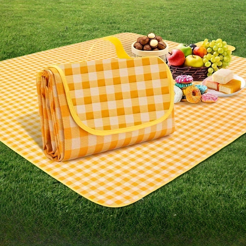 Waterproof picnic blanket with portable storage bag made of durable non-woven fabric. Foldable and moisture-resistant mat perfect for camping, beach, and outdoor activities. Features