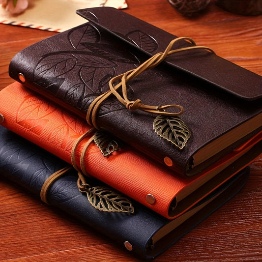 Vintage spiral-bound faux leather notebook with leaf-embossed design and strap closure, available in black, orange, and blue, perfect for students and travelers.