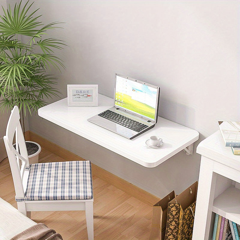 White wooden wall-mounted folding desk with adjustable computer monitor and laptop stand made of cork material, perfect for home and office organization in kitchens and dorms.