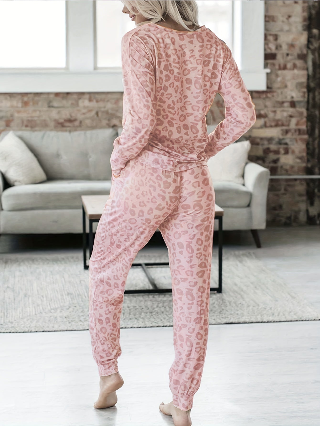 Leopard print lounge set with V-neck top and lace-up pants for women's loungewear and sleepwear.