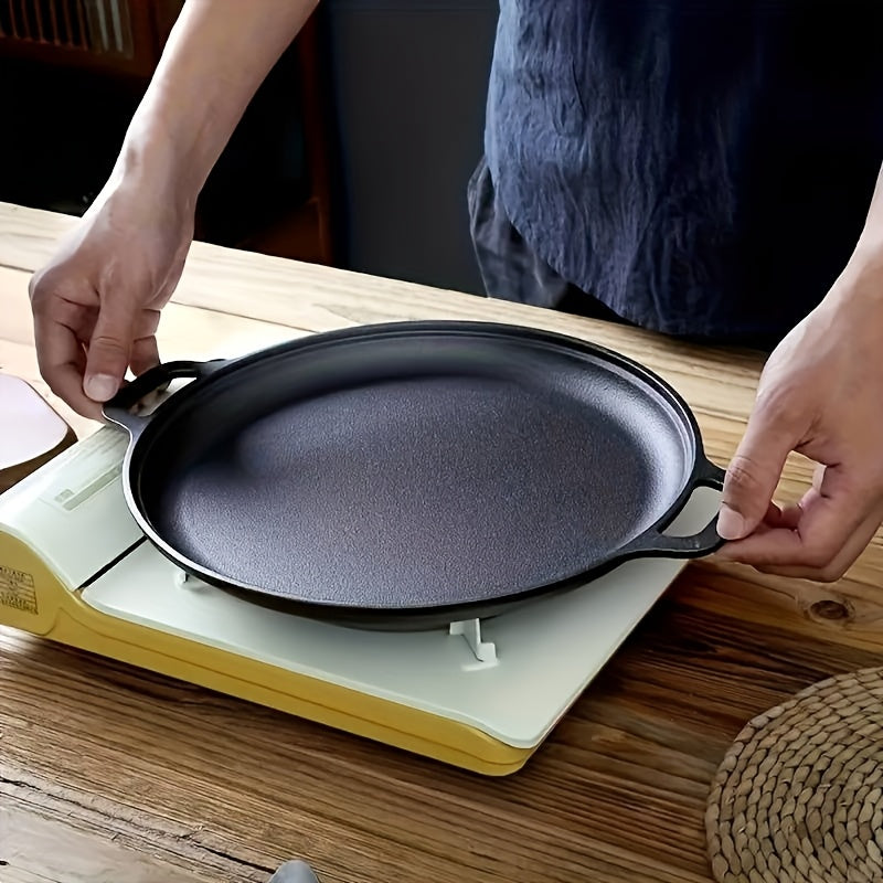 Multi-function cast iron griddle skillet for pizza, BBQ, and pancakes. Non-stick pan suitable for all stovetops. Ideal for home and outdoor cooking.