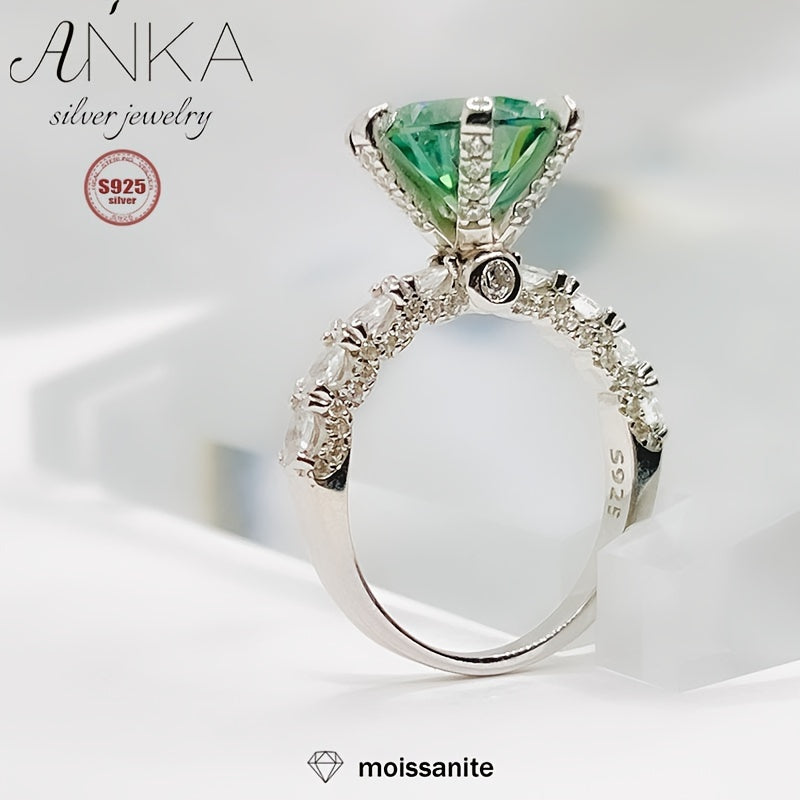 Classy S925 Sterling Silver Ring featuring a stunning 3ct Green Moissanite stone, perfect for engagements or as a luxurious gift. The band is embellished with non-plated Moissanite stones, making it suitable for all seasons. Available in sizes 3.3-3.5g.