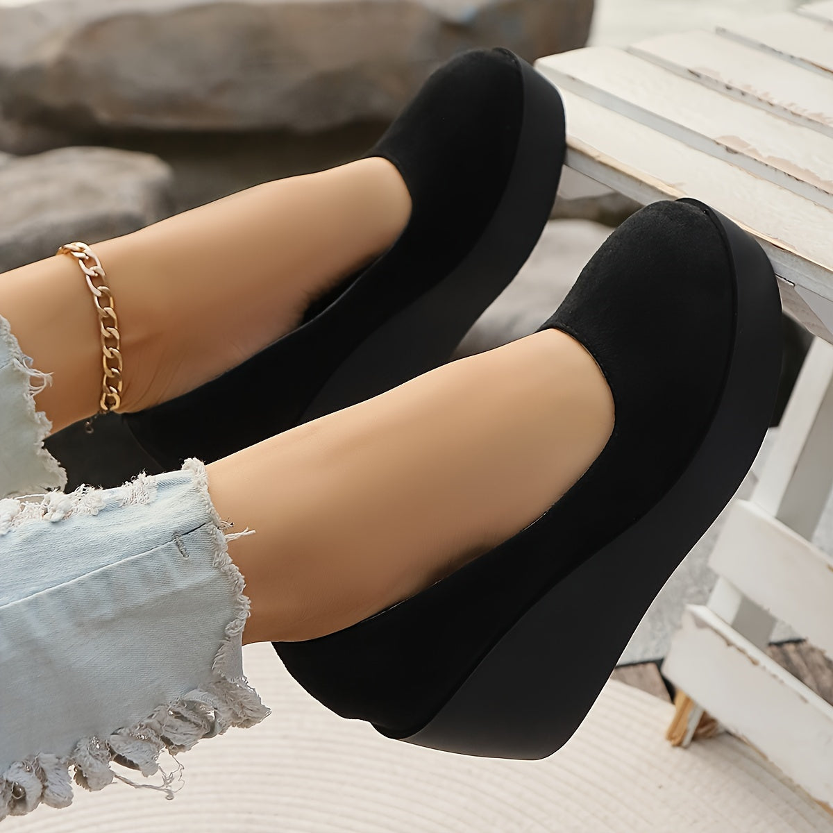 Women's stylish black slip-on platform wedge loafers for casual daily wear.