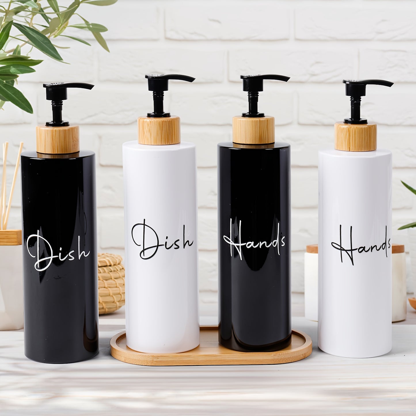 Set of 2 black refillable soap dispensers with wooden handles, made from lead-free plastic. Suitable for hand and dish soap, great for bathroom organization and storage, and elegant home decor accessories.