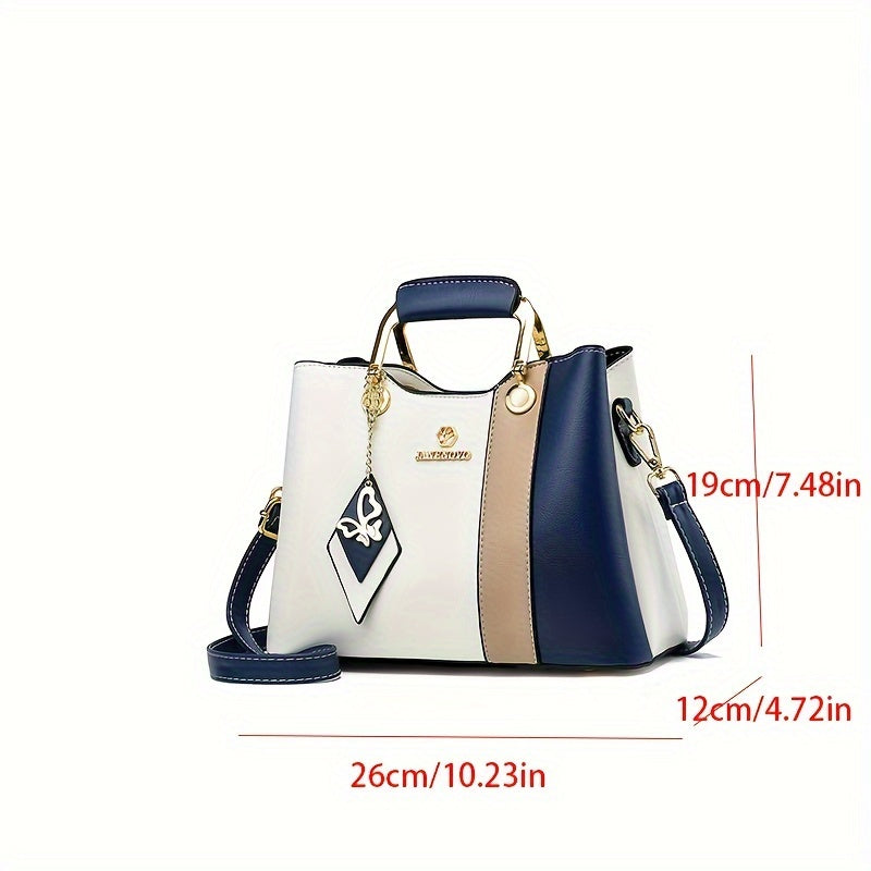 Chic navy blue, white, and beige colorblock tote with golden hardware, adjustable strap, magnetic closure, spacious interior, and lightweight design - perfect for daily use.