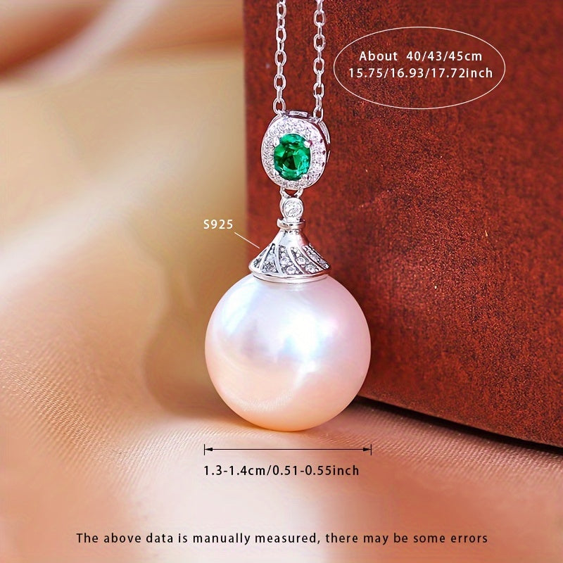 Give your loved one a special treat with this must-have gift box containing a stunning S925 silver pendant necklace featuring a 13-14mm round natural freshwater pearl. Each necklace is unique, with variations in natural pearls, shapes, and colors. The