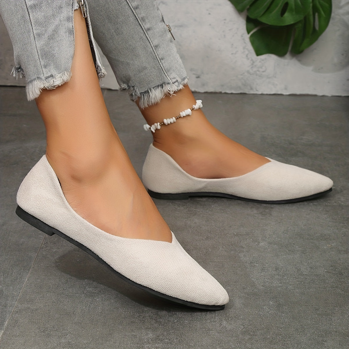 Women's solid color flat shoes with elegant point toe and lightweight slip on design.