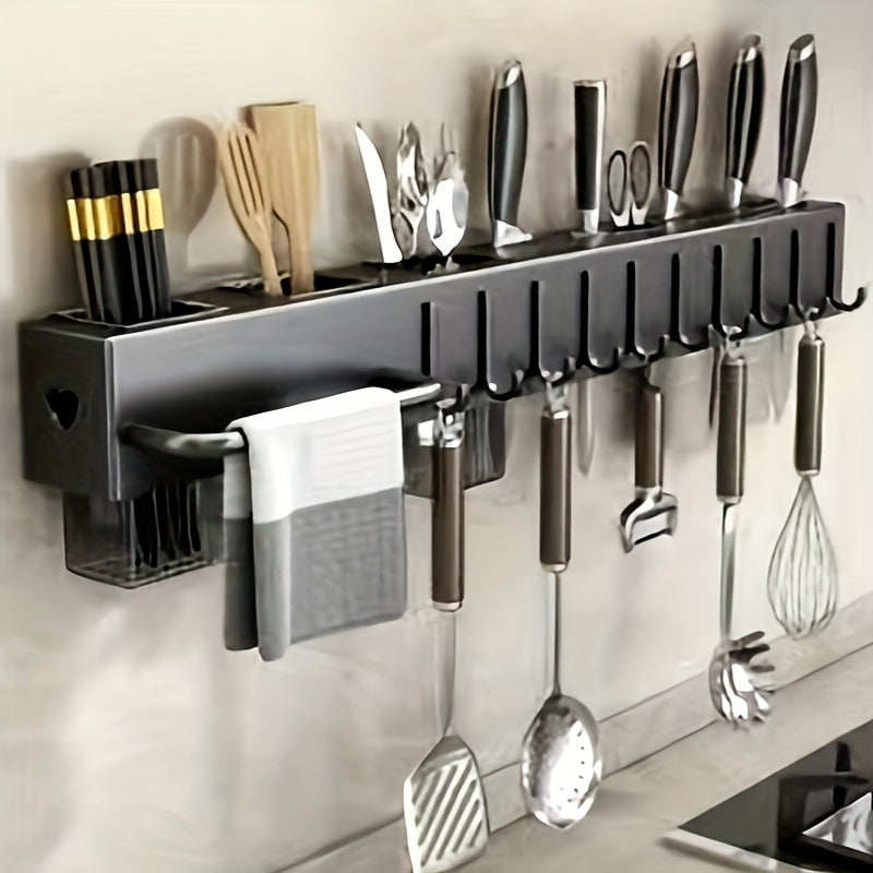 Wall-mounted carbon steel kitchen organizer featuring a no-drill design. This multi-functional rack is perfect for storing knives, forks, spoons, and chopsticks, with added features such as drainage and a towel holder.